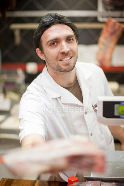 Portrait of butcher wearing hairnet — Stock Photo
