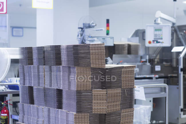 Front view of cardboard boxes in medical manufacturing plant — Stock Photo