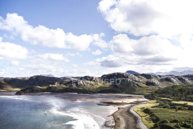 Elevated view of sea and beach under cloudy sky — Stock Photo