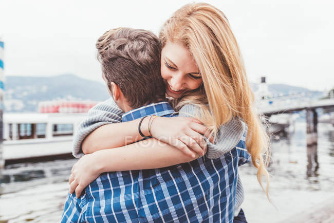 Young couple hugging on lakeside, Lake Como, Italy — Stock Photo