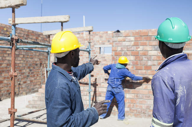 African Builders Working On Construction Site Guidance Men Stock 