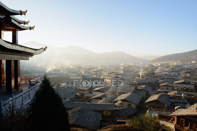 Village rooftops viewed from hill — Stock Photo