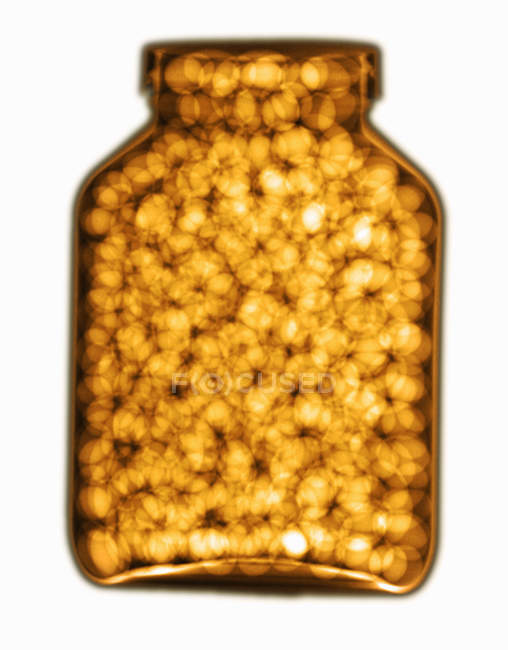 Colorized x-ray of bottle of pills isolated on white background — Stock Photo