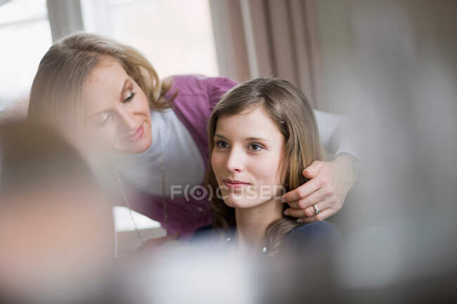 Happy mother and daughter preparing — Stock Photo