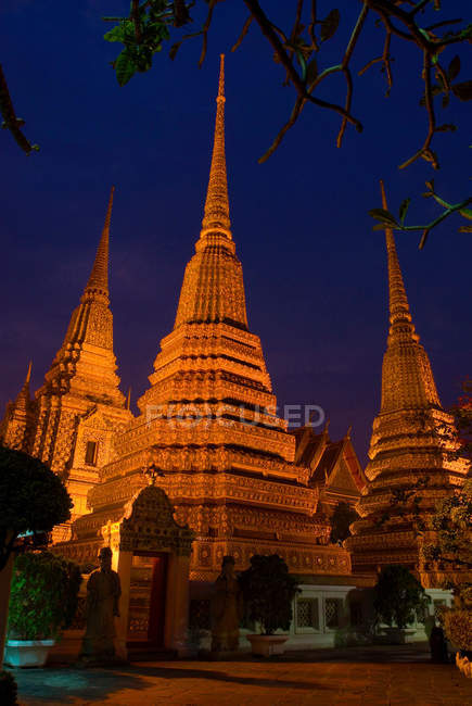 Ornate carved spires lit up — Stock Photo