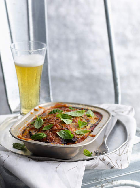 Stewed meat with glass of beer — Stock Photo