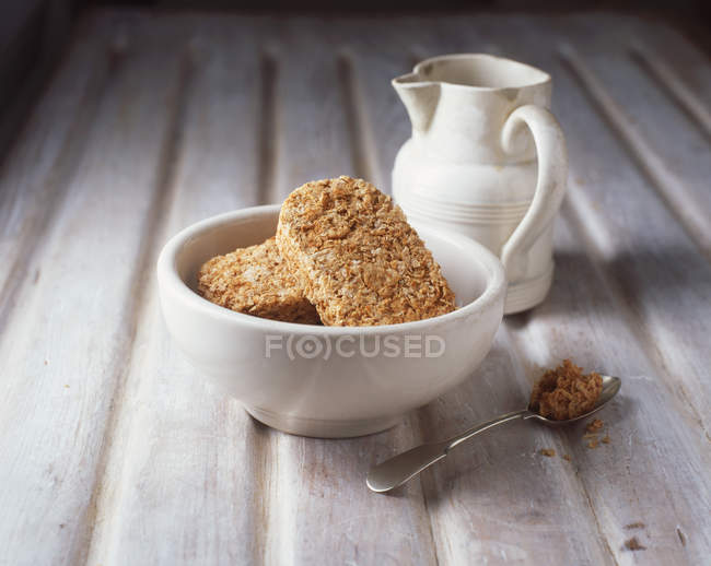 Food, breakfast cereal, wheat biscuits, jug of milk — Stock Photo