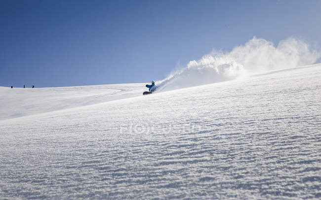 Male snowboarder snowboarding down mountain, Trient, Swiss Alps, Switzerland — Stock Photo