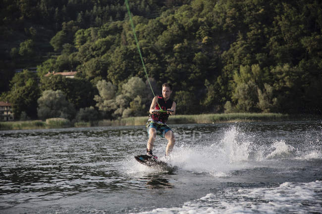 Waterskier waterskiing on  Maggiore lake, Verbania, Piedmont, Italy — Stock Photo