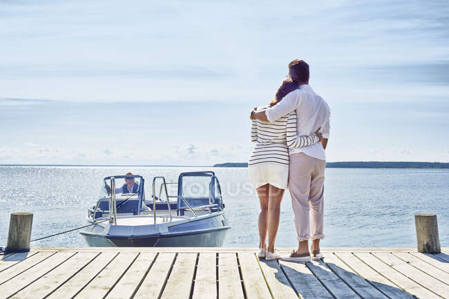 Young couple on pier looking at view, Gavle, Sweden — Stock Photo