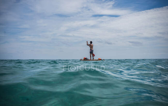 Woman paddleboarding, Olbia, Sardinia, Italy — Stock Photo