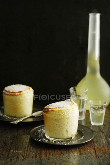 Souffle desserts and limoncello — Stock Photo