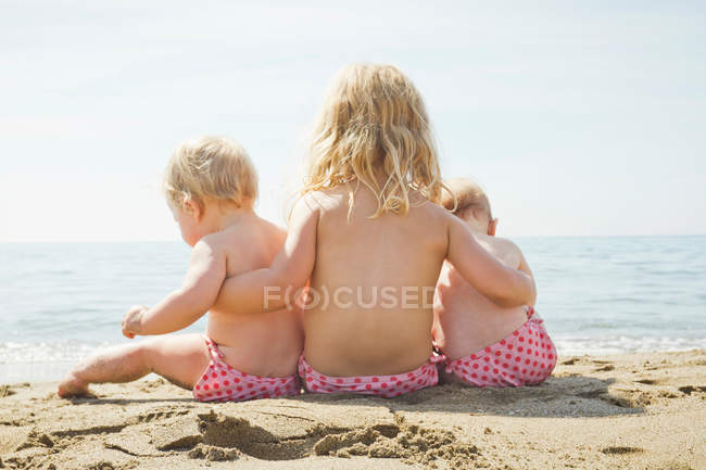 Children in matching bikini bottoms — Stock Photo