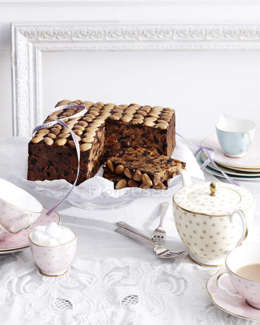 Gran marnier fruit cake on traditional tea table — Stock Photo