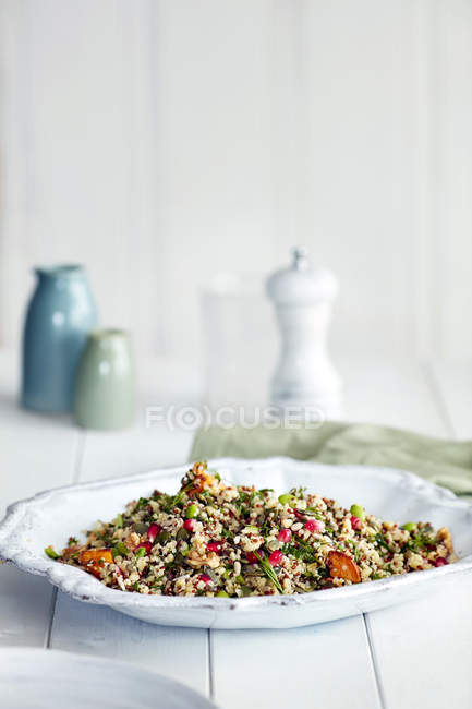 Portion of supergrain salad with bulgur on table — Stock Photo