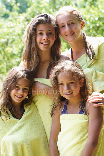 Girls wrapped in towels after swimming, focus on foreground — Stock Photo