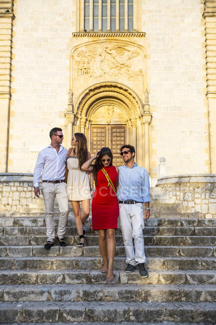 Two tourist couples on church stairway, Calvia, Majorca, Spain — Stock Photo