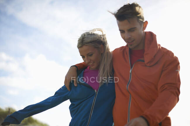 Couple walking together smiling — Stock Photo