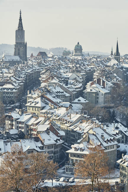 High angle view of city and skyline with snow covered rooftops, Berne, Switzerland — Stock Photo