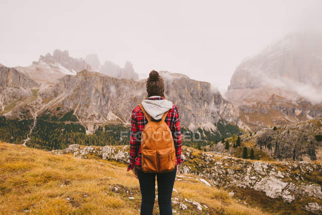 Hiker looking out at Mount Lagazuoi, Dolomite Alps, South Tyrol, Italy — Stock Photo