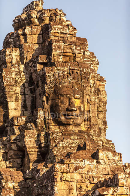 Giant Buddha face at Bayon Temple — Stock Photo