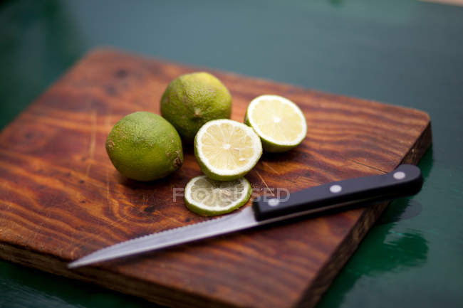 Lime on wooden board — Stock Photo