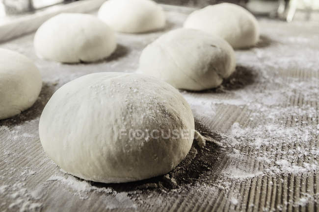 Close-up view of fresh raw pizza dough — Stock Photo