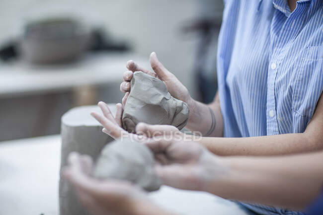 Cape Town, South Africa, two females moulding out clay in ceramic workshop — Stock Photo