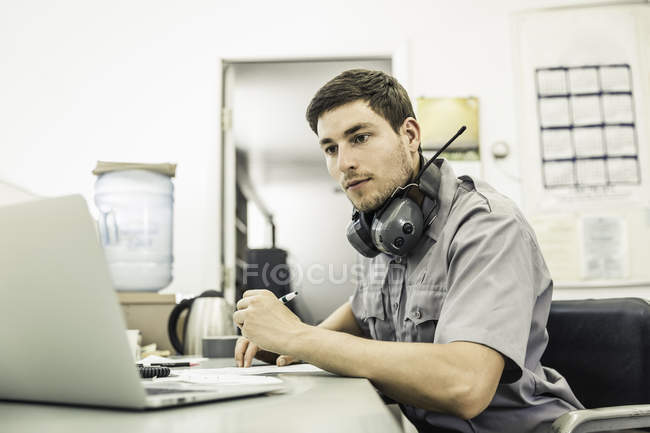 Scientist using laptop in plant growth research facility office — Stock Photo