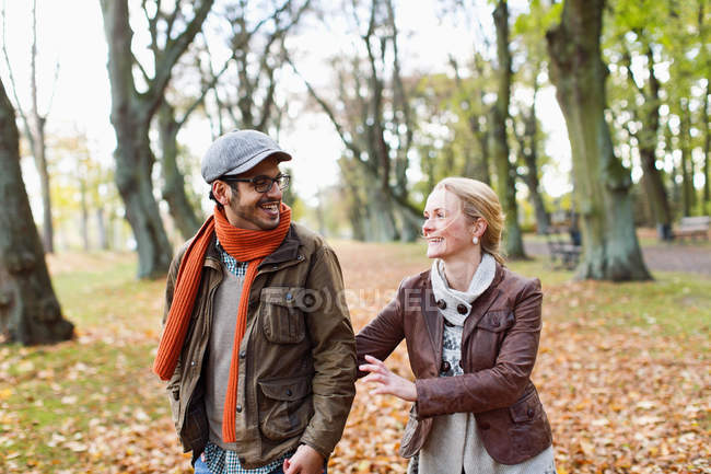 Couple walking together in forest — Stock Photo