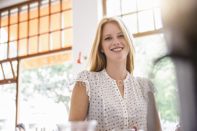 Young blonde woman smiling — Stock Photo