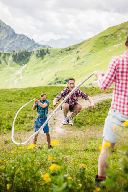 Young man skipping with rope, Tyrol, Austria — Stock Photo