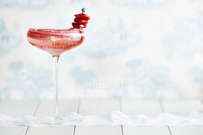 Cocktail in champagne glass with rhubarb — Stock Photo