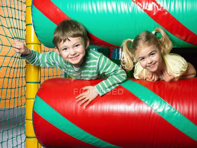 Boy and girl in soft play area — Stock Photo