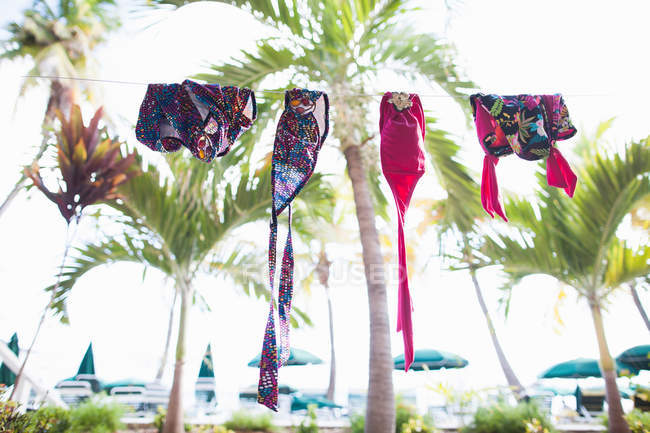 Swimwear hanging on clothesline — Stock Photo