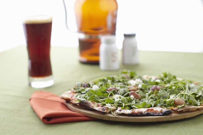 Close up shot of cheese and rocket pizza — Stock Photo