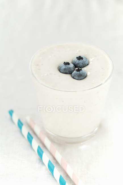 Still life of fresh blueberry smoothie on table — Stock Photo