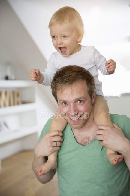 carrying baby on shoulders