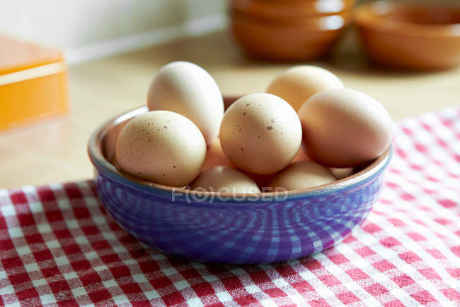 Bowl of eggs on napkin — Stock Photo