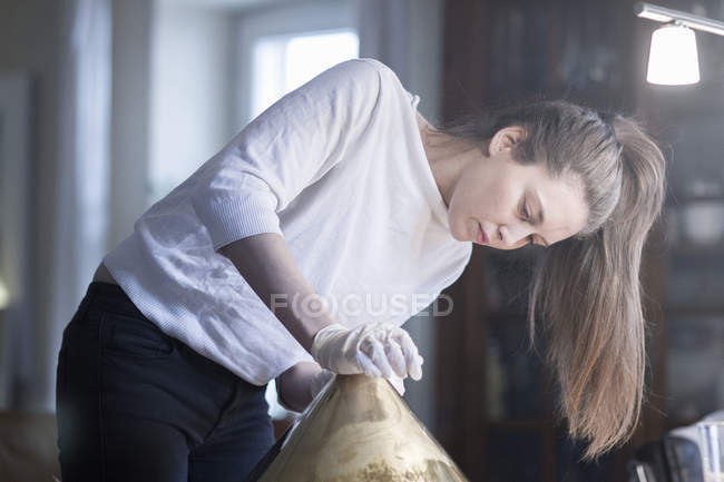 Young female craftswoman in workshop — Stock Photo