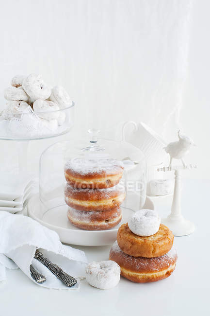 Trays and stacks of donuts — Stock Photo