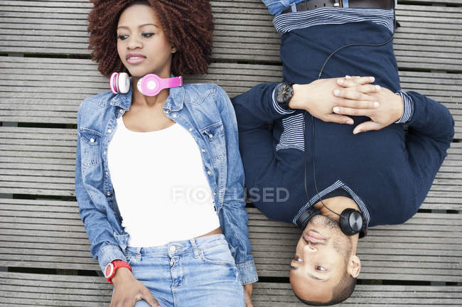 Young couple on jetty, overhead view — Stock Photo