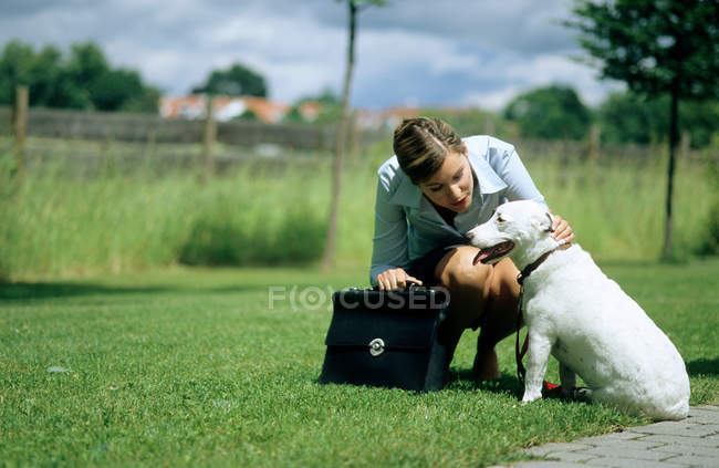 Dog and owner on way to work — Stock Photo