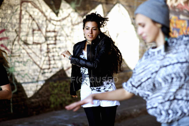 Young women dancing in the street — Stock Photo