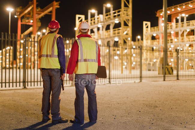 Workers standing together in shipyard — Stock Photo