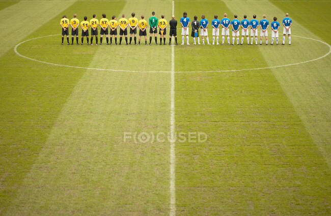 Football teams on pitch — Stock Photo