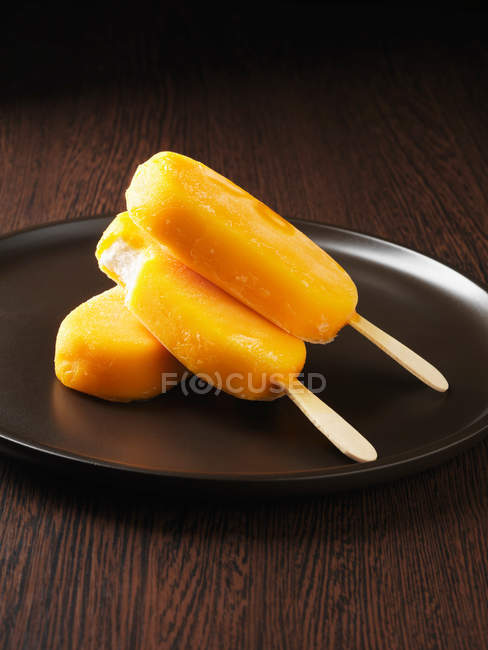 Ice cream in orange shell — Stock Photo