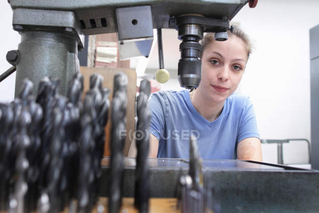 Portrait of female engineer in workshop — Stock Photo
