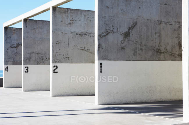 Labeled concrete walls in bright sunlight — Stock Photo