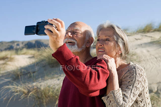 Senior couple taking a self portrait — Stock Photo